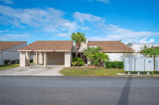 ranch-style home with a front lawn