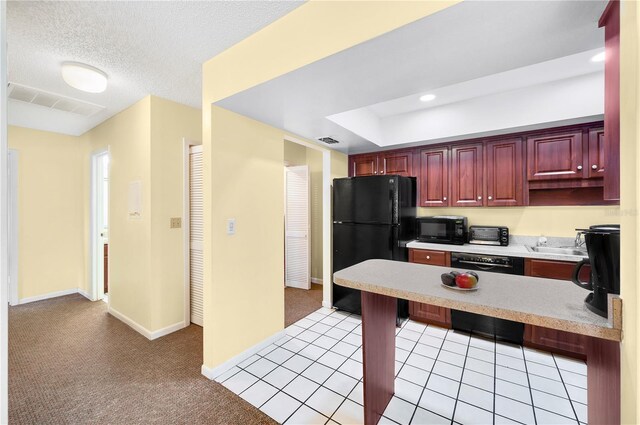4241 Oak Loop Unit 36, Mulberry, FL 33860 - kitchen featuring black appliances, light tile patterned floors, sink, and a textured ceiling