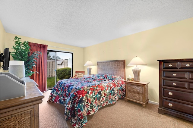 4241 Oak Loop Unit 36, Mulberry, FL 33860 - carpeted bedroom featuring access to outside and a textured ceiling