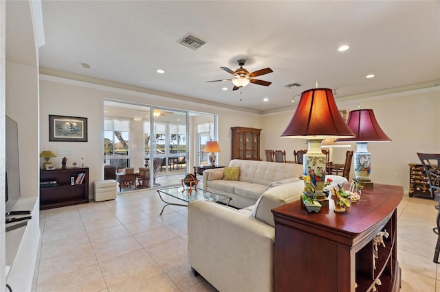 living room featuring light tile patterned floors, crown molding, and ceiling fan