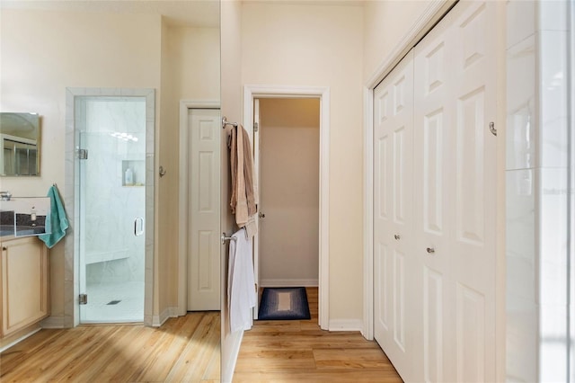 corridor featuring light hardwood / wood-style flooring