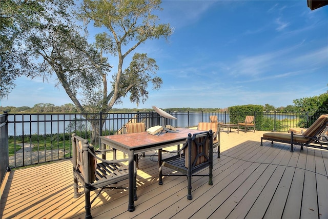 wooden terrace with a water view