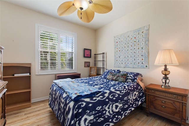 bedroom featuring ceiling fan and light hardwood / wood-style floors