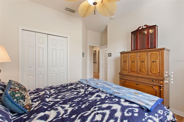 bedroom with ceiling fan and a closet