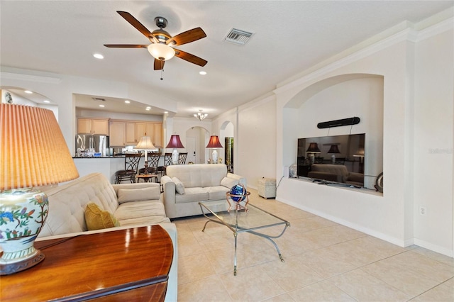 tiled living room with crown molding and ceiling fan