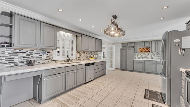 kitchen featuring light tile patterned flooring, ornamental molding, appliances with stainless steel finishes, gray cabinets, and pendant lighting