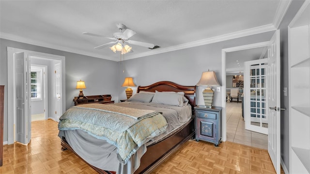 bedroom with ceiling fan, ornamental molding, and light parquet floors