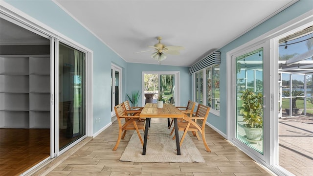 sunroom / solarium with ceiling fan