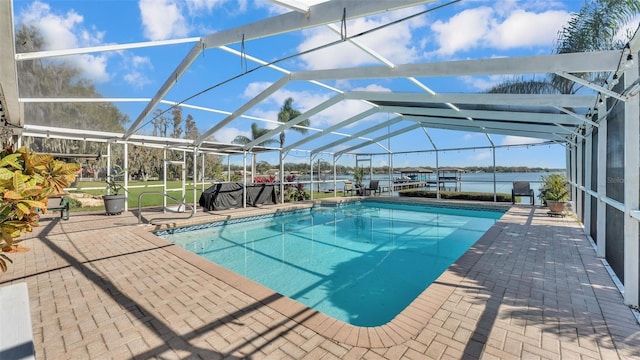 view of swimming pool featuring a water view, a lanai, and a patio