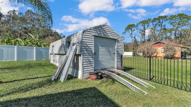 view of outbuilding featuring a yard