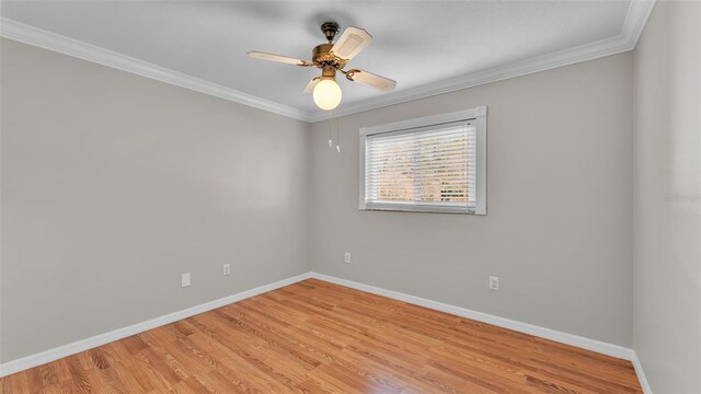 unfurnished room featuring ornamental molding, ceiling fan, and light hardwood / wood-style flooring