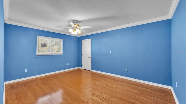 unfurnished room featuring hardwood / wood-style flooring, ornamental molding, and a textured ceiling