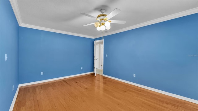 unfurnished room featuring hardwood / wood-style flooring, ornamental molding, and ceiling fan