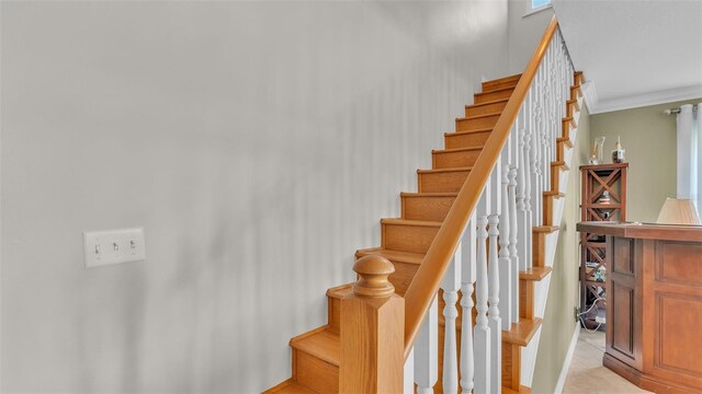 stairs featuring ornamental molding