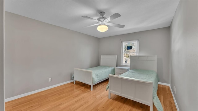 bedroom featuring ceiling fan and light hardwood / wood-style floors