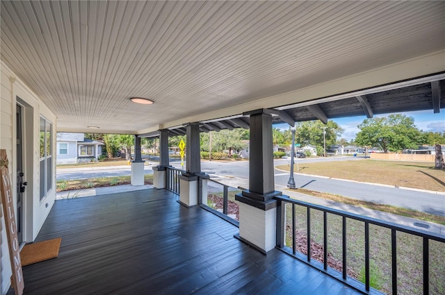 wooden terrace featuring a porch