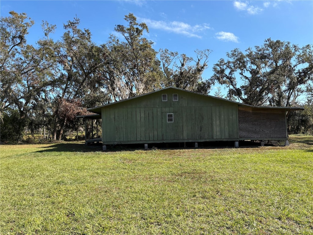 view of side of home featuring a yard