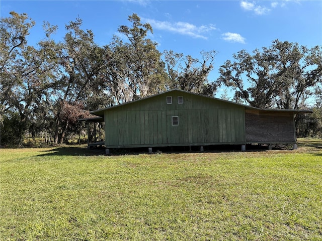 view of side of home featuring a yard