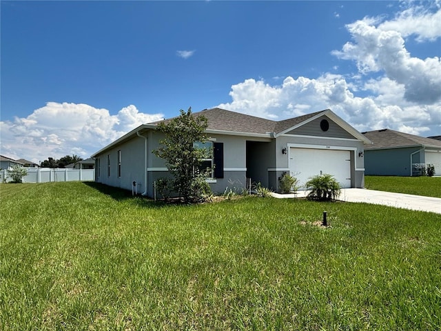 ranch-style home featuring a garage and a front yard