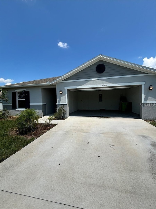 ranch-style home featuring a garage