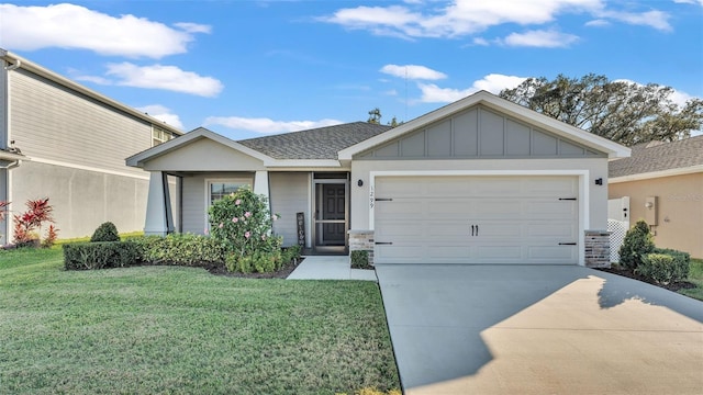 view of front of house with a front yard and a garage