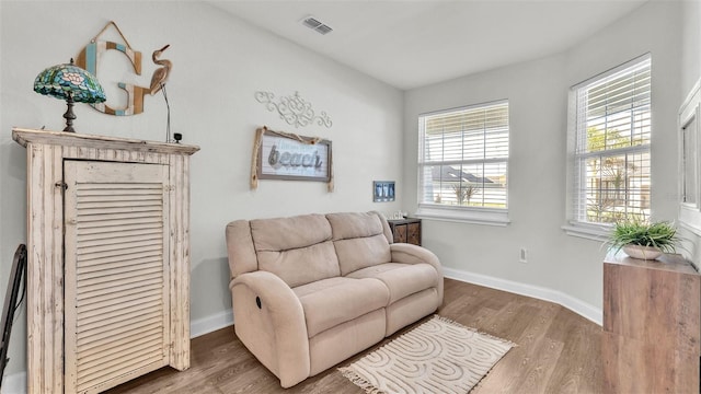 sitting room with dark hardwood / wood-style flooring