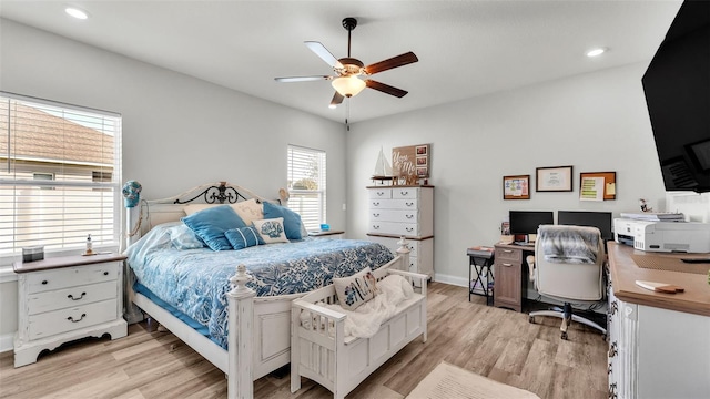 bedroom with light hardwood / wood-style flooring and ceiling fan