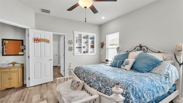 bedroom featuring light hardwood / wood-style floors and ceiling fan