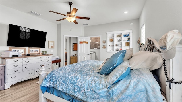 bedroom with light hardwood / wood-style floors and ceiling fan