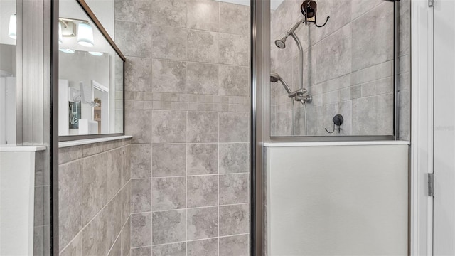 bathroom featuring a shower with shower door