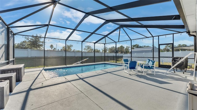 view of pool featuring a patio area and a lanai