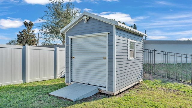 view of outbuilding with a yard