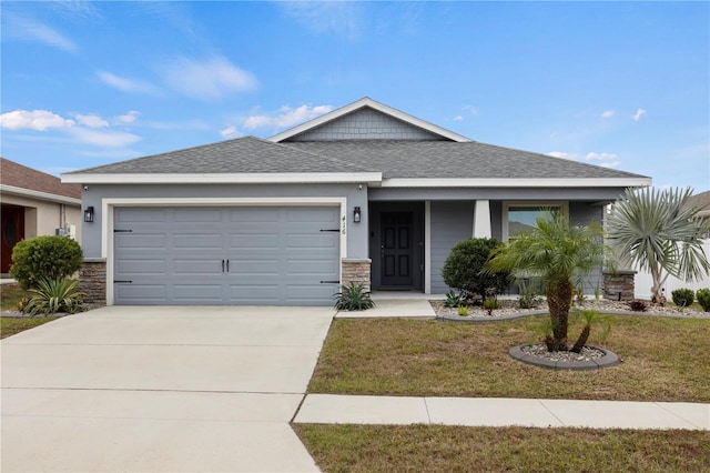 view of front of home with a front lawn and a garage