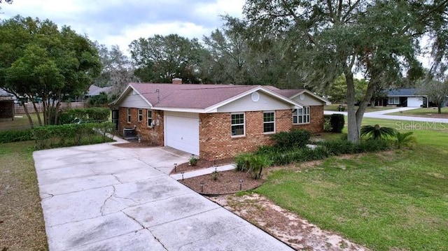 exterior space with a garage and a front lawn