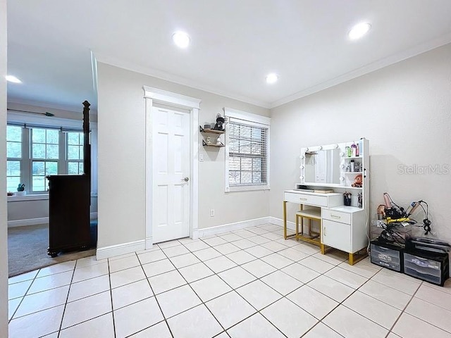 unfurnished office featuring ornamental molding and light tile patterned floors