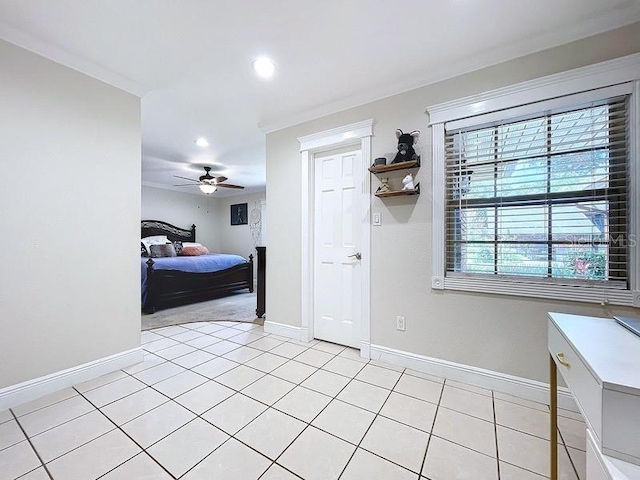 bedroom with ceiling fan, crown molding, and light tile patterned flooring