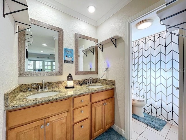 bathroom with vanity, tile patterned floors, crown molding, toilet, and curtained shower