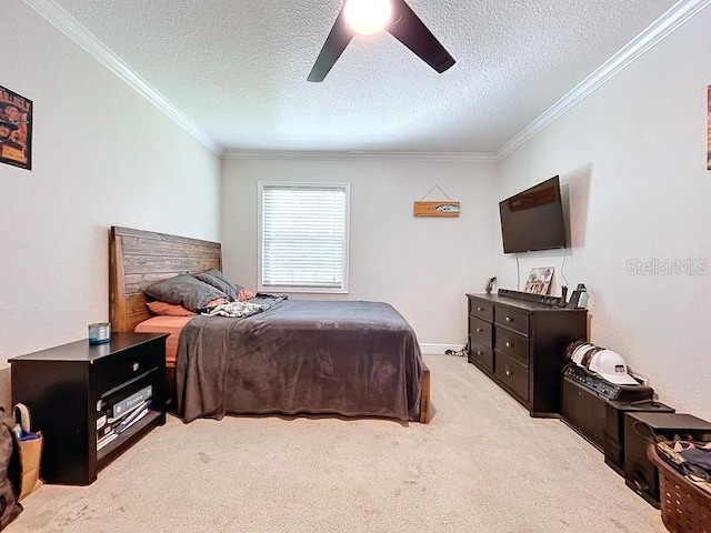 carpeted bedroom featuring a textured ceiling, ceiling fan, and ornamental molding