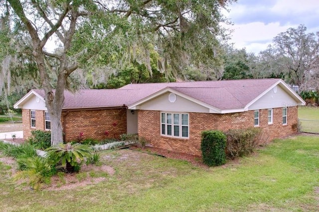 single story home with a front yard