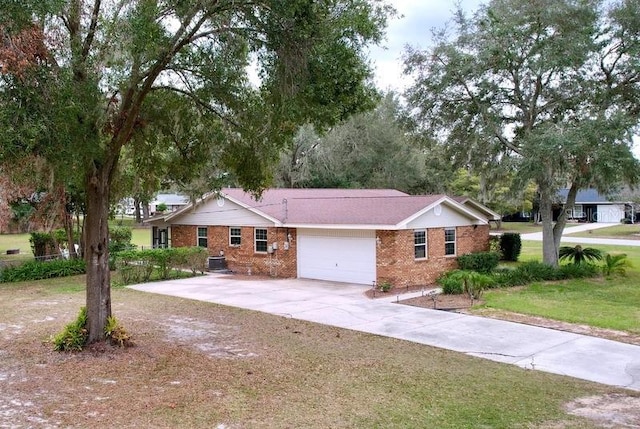 single story home featuring a front yard and a garage