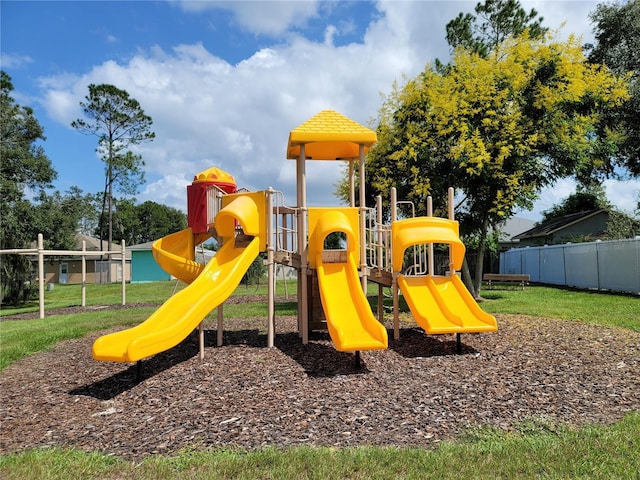 view of playground featuring a lawn