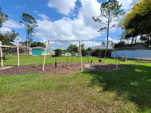 view of jungle gym featuring a lawn