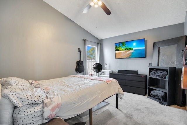 bedroom featuring ceiling fan, light colored carpet, and lofted ceiling