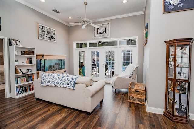 living room with ceiling fan, ornamental molding, dark wood-type flooring, and french doors