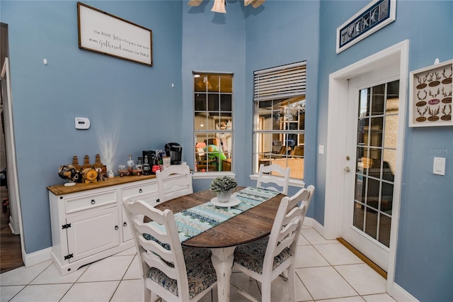 dining area featuring light tile patterned floors