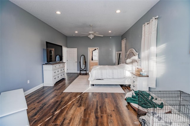 bedroom featuring a textured ceiling, ceiling fan, and dark wood-type flooring