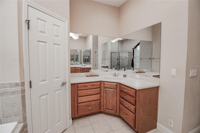 bathroom with tile patterned flooring, a shower, and vanity