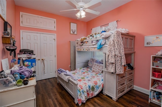 bedroom with dark hardwood / wood-style flooring, a closet, and ceiling fan