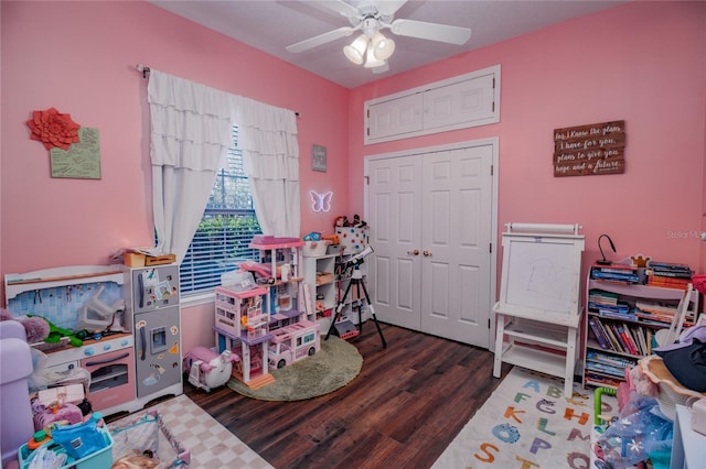 game room featuring ceiling fan and dark wood-type flooring