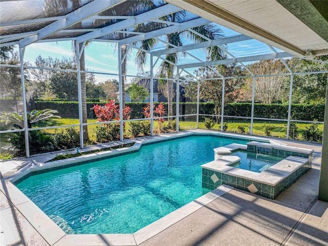 view of pool featuring a lanai, an in ground hot tub, and a patio